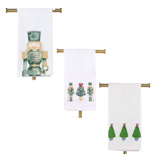 Introduce festive flair to your kitchen with our Christmas Hand Towel, available in three charming designs: Christmas Topiary, Nutcracker, and Nutcracker Trio. Made with absorbent material, it's perfect for drying dishes and spills. Bring holiday cheer to your home this season!