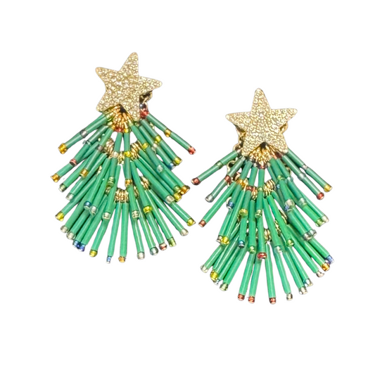 Elevate your festive style with these expertly crafted Christmas Tree dangle earrings from Golden Stella. Featuring a delicate design that captures the holiday spirit, these earrings offer lightweight comfort and elegant movement. Perfect for adding a subtle yet sophisticated touch to your seasonal wardrobe, they showcase quality craftsmanship that complements any holiday occasion.