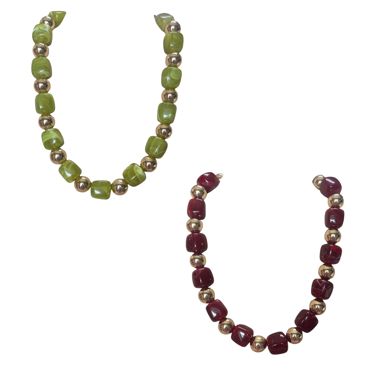 Elegant short necklace featuring vibrant colored beads with luxurious gold accents. Choose between rich red or fresh green to complement your style. This piece from ETE brand brings sophistication to any outfit, perfect for layering or wearing alone. A versatile accessory that adds personality and refinement to your everyday look.