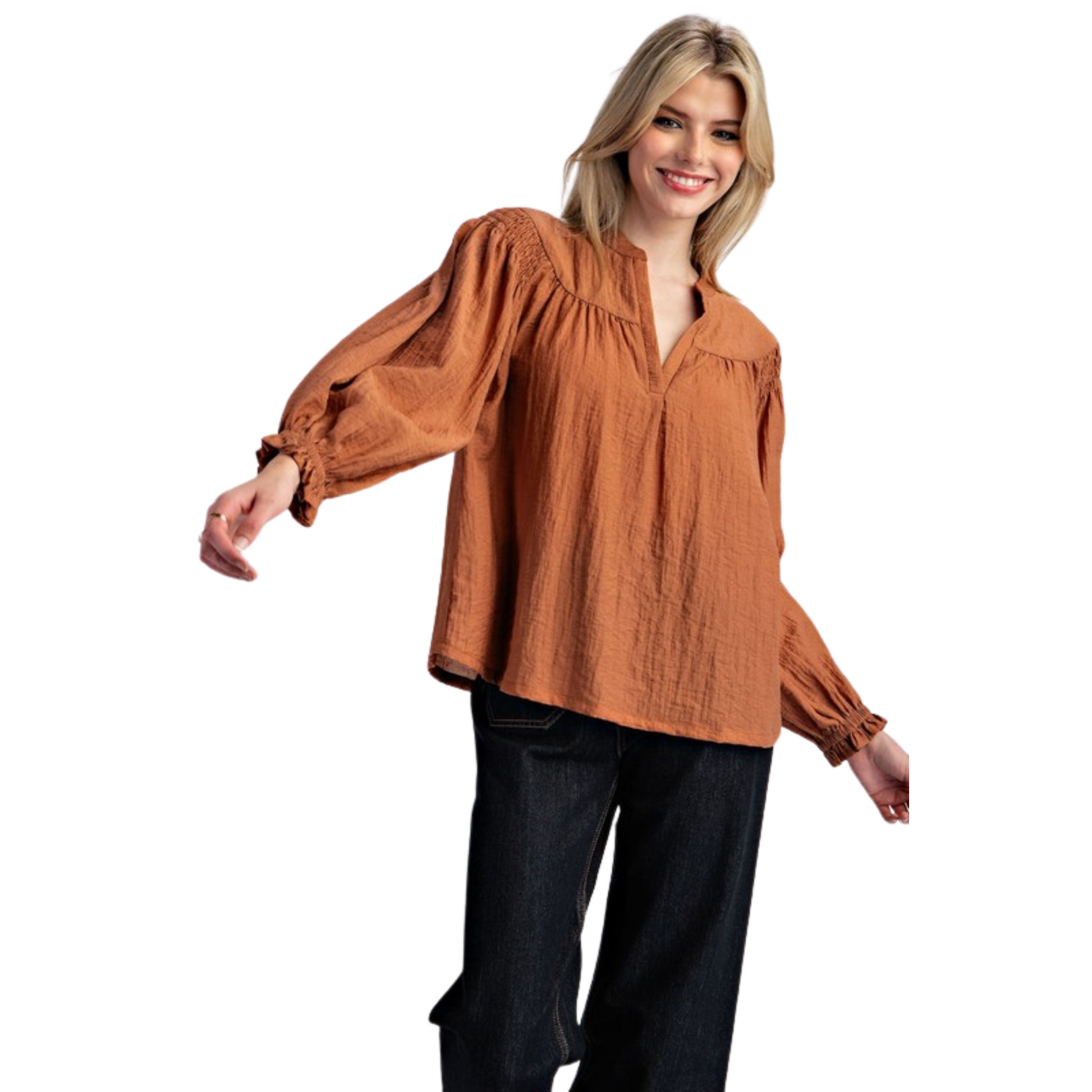 Solid long sleeve blouse top featuring a notched neckline, added seams and pinching for detail, smocked shoulders, elastic cuffs and is a lightweight material, perfect for transitioning seasons.