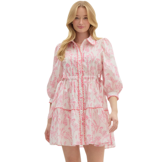 This Entro brand mini dress features a beautiful pink floral print and cinched waist, making it the perfect addition to your wardrobe. With a versatile style and flattering fit, this dress is sure to become a staple piece for any occasion. Make a statement with this must-have dress.