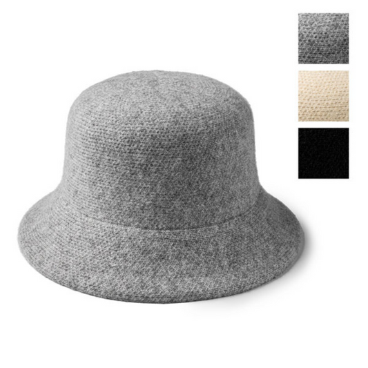 This classic cloche style hat from Britt's Knits features an adjustable fit and three color options—black, oatmeal, and grey—to suit any wardrobe. With its timeless design, you can look stylish without sacrificing comfort.