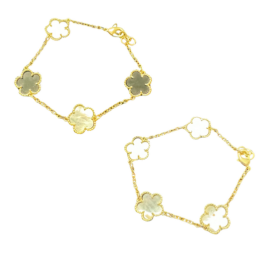 Effortlessly elevate your style with our Adjustable Clover Bracelet. Made with stunning gold and adorned with mother of pearl accents, this unique clover design adds a touch of sophistication to any outfit. Customize the fit for a comfortable and chic accessory.