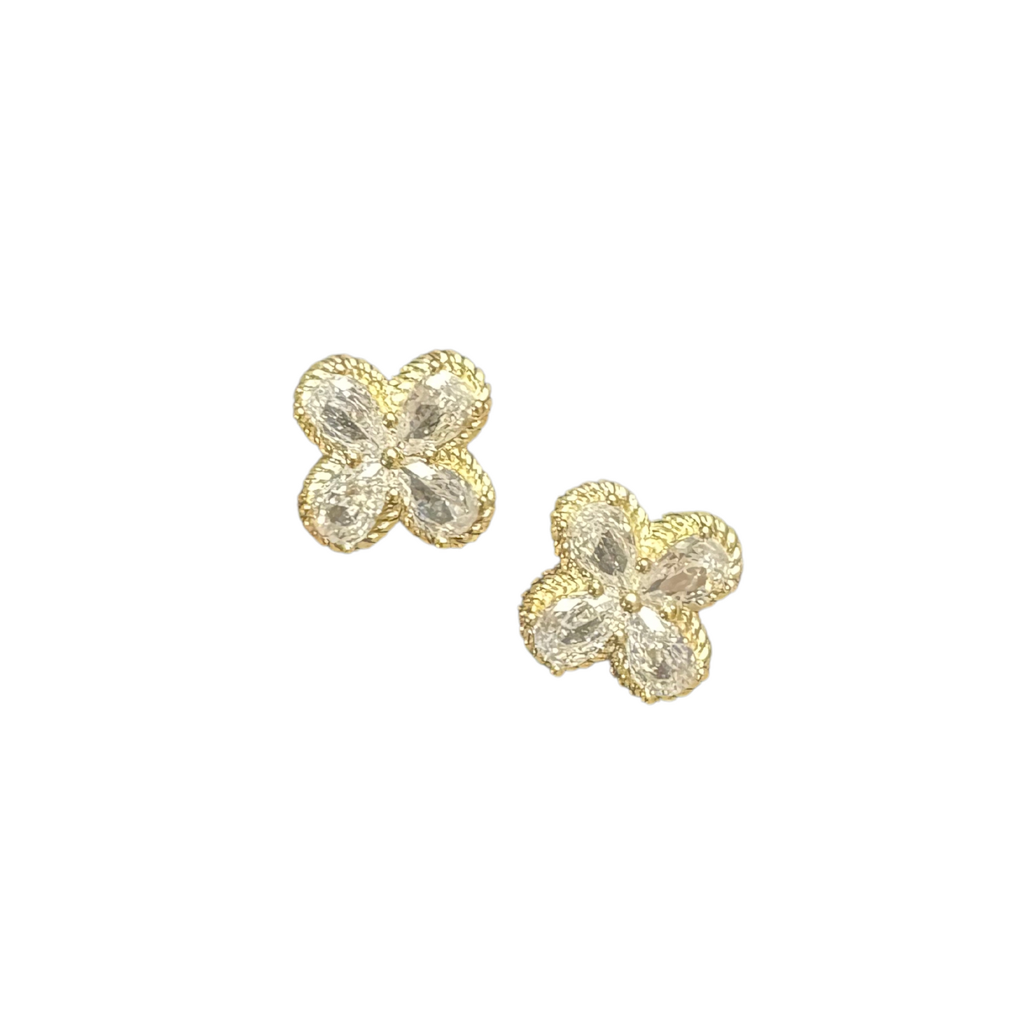 Expertly crafted with precision, these Clover Stud Earrings from MX Brand feature a dazzling rhinestone clover accent in a stunning gold finish. Add a touch of delicate sophistication to any outfit with these elegant stud earrings.