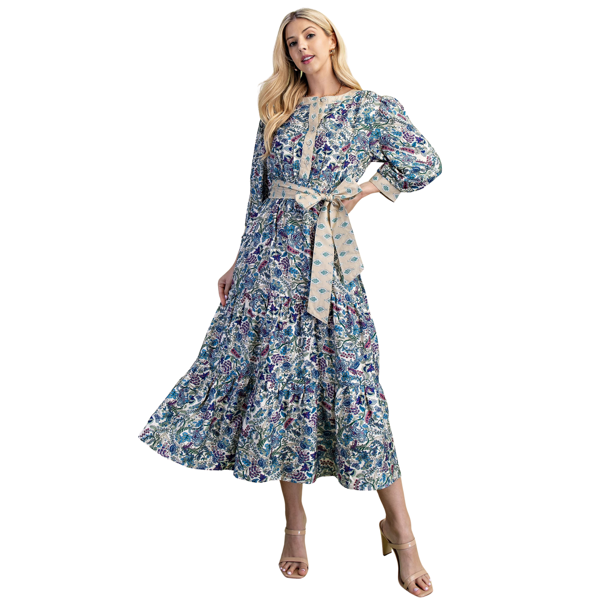The GiGio Tiered Half Button Midi Dress in cobalt blue combines refined style with expert tailoring. Featuring long sleeves and a flattering belted waist, this dress offers a sophisticated silhouette that enhances your figure. Its midi length and tiered design create a graceful flow, perfect for both professional settings and elegant occasions. Crafted to deliver both comfort and confidence, this dress is a versatile addition to any wardrobe.