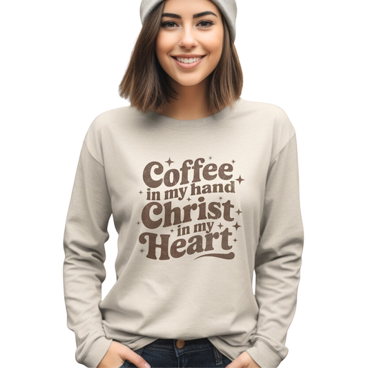 Elevate your everyday wardrobe with this meaningful graphic tee from Carmelo. Featuring a bold "Coffee in my hand, Christ in my heart" design, this long-sleeve shirt combines comfort with purposeful style. The sand color offers versatile pairing options for casual wear, while the quality construction ensures durability through regular wear. Perfect for those seeking apparel that reflects their values and faith.