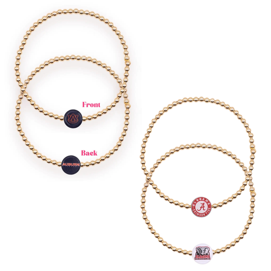 Show your school spirit with this Beaded Blondes collegiate bracelet, featuring lustrous gold beads strung together for a timeless, elegant look. Perfect for game days or everyday wear, this bracelet celebrates your pride in Auburn or Alabama. The classic gold-and-bead design complements any outfit while making a bold statement about your loyalty. Available in your choice of school colors to match your team.
