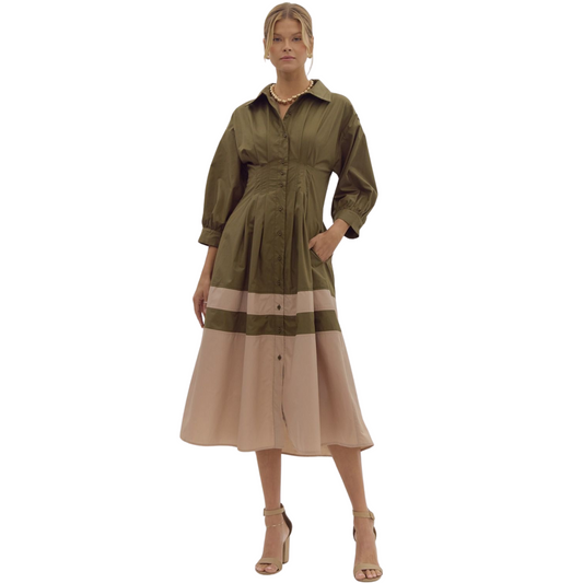 Dress to impress in our Colorblock Shirt Dress. With a refined collared design, this midi dress features pleat details for a flattering silhouette and a defined waist. The woven, lightweight fabric is non-sheer and fully lined, making it a perfect choice for any occasion. Available in a stunning olive color.