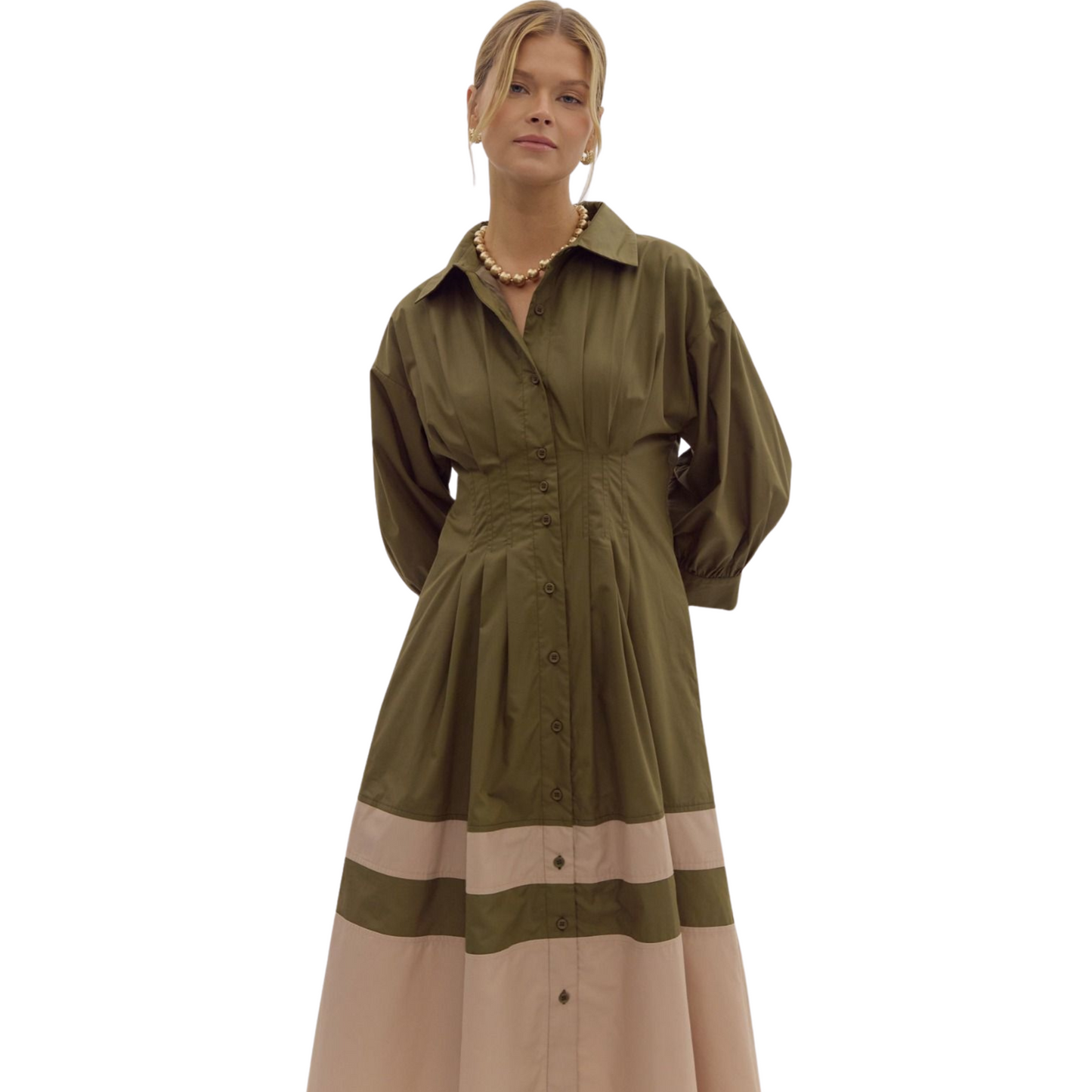 Dress to impress in our Colorblock Shirt Dress. With a refined collared design, this midi dress features pleat details for a flattering silhouette and a defined waist. The woven, lightweight fabric is non-sheer and fully lined, making it a perfect choice for any occasion. Available in a stunning olive color.