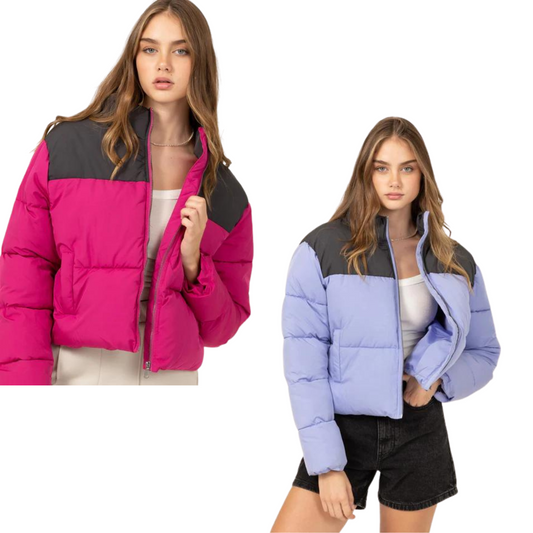 Look cool and stay warm in our Color Block Puffer Jacket. This stylish jacket features a high neckline and long sleeves to keep you cozy all day and night. The relaxed fit is just perfect for any look, and the front zipper closure ensures optimum warmth and comfort. Available in jam or pastel indigo.