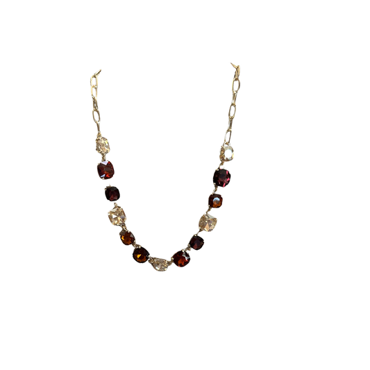 Elevate your everyday look with this stunning Colored Rhinestone Necklace by Perdido Gems. Featuring vibrant multicolor rhinestones set in lustrous gold, this short necklace adds instant sparkle and sophistication to any outfit. Perfect for layering or wearing solo, it's the ideal accessory for both casual days and special occasions. The eye-catching design catches light beautifully, making it a versatile piece that complements any style.