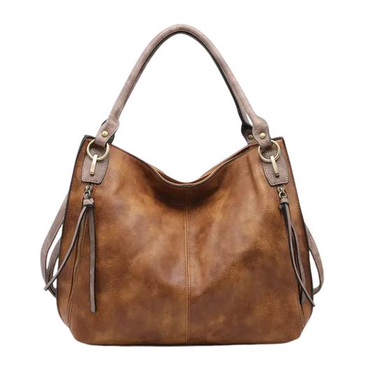 The Conner Distressed Side Pocket Tote by Jen &amp; Co. combines rugged style with practical design. Crafted in a rich brown distressed finish, this large tote offers ample space for daily essentials and features a convenient side pocket for easy access to smaller items. Its durable construction ensures long-lasting use, making it an ideal choice for those seeking both fashion and functionality in a versatile everyday bag.