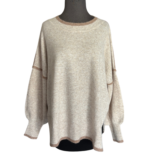 This She+Sky Contrast Sweater Top in oatmeal offers a refined blend of comfort and style. Crafted with soft fabric and featuring long sleeves, it provides cozy warmth while maintaining breathability. Its versatile oatmeal hue pairs effortlessly with any wardrobe, making it a practical choice for layering in cooler weather. Ideal for those seeking everyday comfort with a polished look, this sweater elevates casual outfits with subtle sophistication.