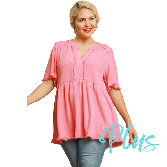 The Linen Split Neck Top by Umgee is a plus size, v-neck top in a beautiful cotton candy color. Its tiered design adds a touch of elegance, making it the perfect addition to any wardrobe. Stay stylish and comfortable in this top from a trusted brand.