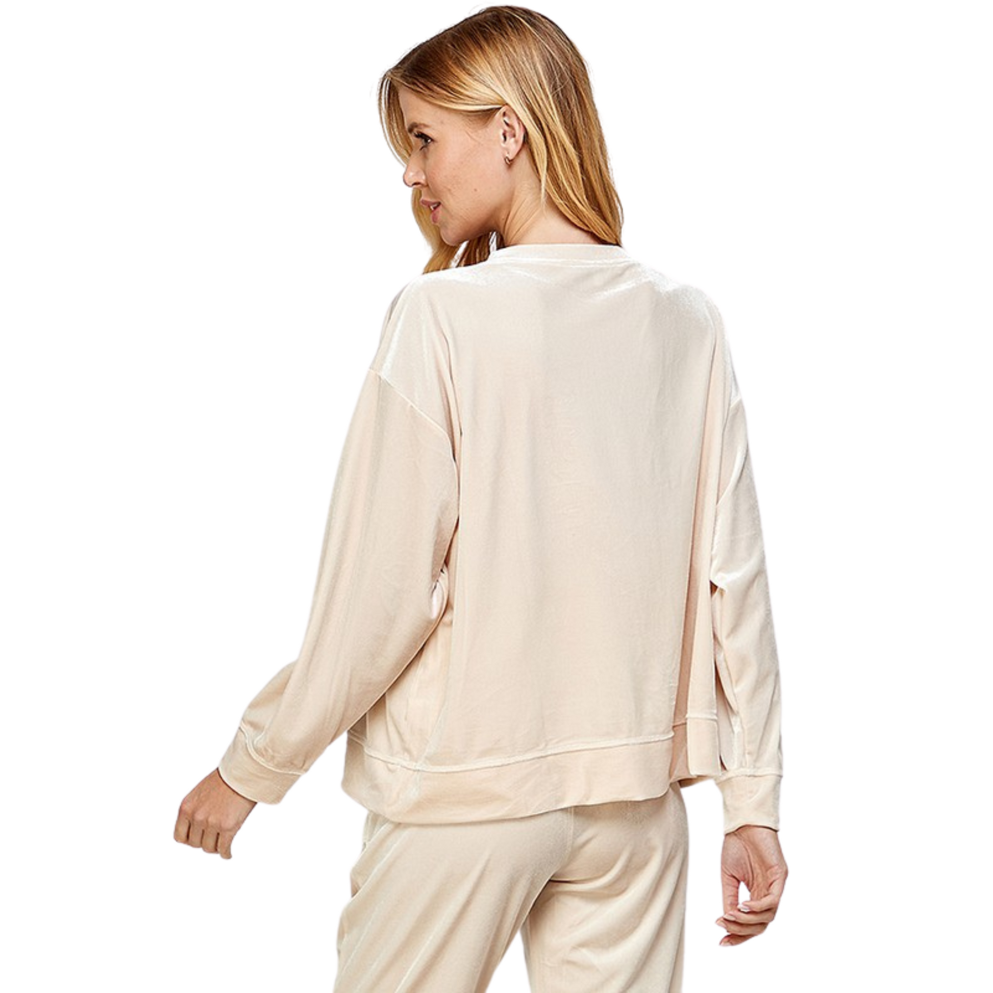 This Velvet Loungewear Top is perfect for cozy lounging. Crafted from a luxurious velvet fabric, this top features a cream color and a comfy fit that feels like a dream. Wear this top for a fashionable and comfortable look.