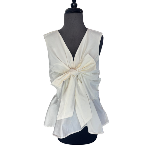 Effortless elegance meets everyday comfort in this Entro sleeveless v-neck top. Crafted in a soft ivory hue, this versatile piece features a charming bow accent at the neckline that adds a touch of feminine sophistication. Perfect for layering or wearing solo, it transitions seamlessly from casual outings to more polished occasions. The sleeveless design keeps you cool while the flattering v-neck creates a refined silhouette. A wardrobe essential that pairs beautifully with jeans, skirts, or trousers.