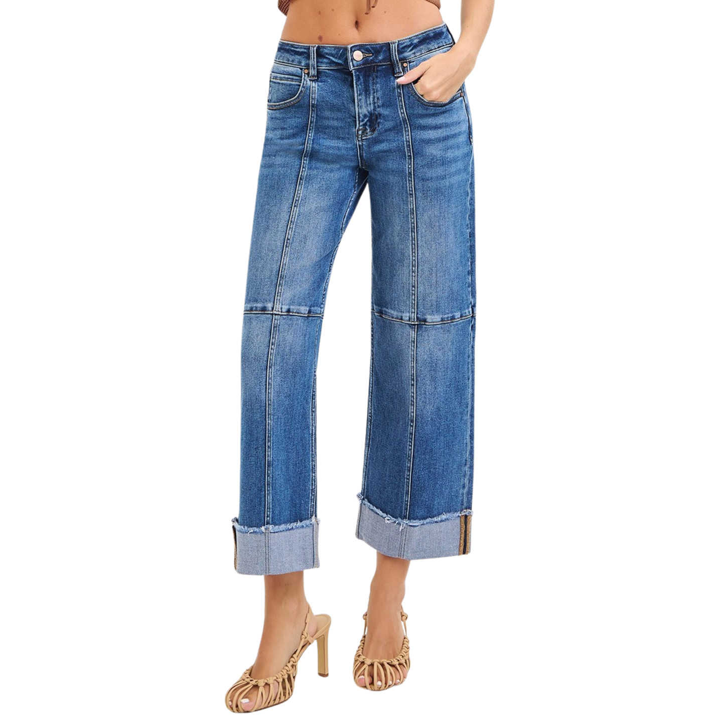Cropped Wide Seam Detail Jeans by Risen offer a modern silhouette with bold seam detailing and a relaxed wide-leg fit. Crafted in a versatile medium wash denim, these jeans feature a cropped length perfect for pairing with sneakers or heels. The distinctive wide seams add contemporary edge while the comfortable wide-leg cut provides effortless style and movement. A wardrobe essential that transitions seamlessly from casual to dressed-up looks.