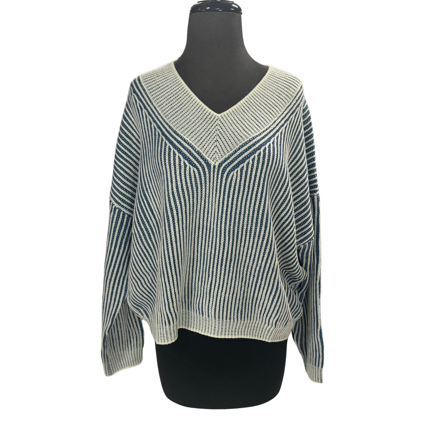 Expertly crafted by HYFVE, this Cropped V-Neck Sweater features a timeless blue and white stripe design. The rib knit ensures a comfortable fit while the cropped style adds a playful touch to any outfit. Stay on trend and cozy with this must-have piece.