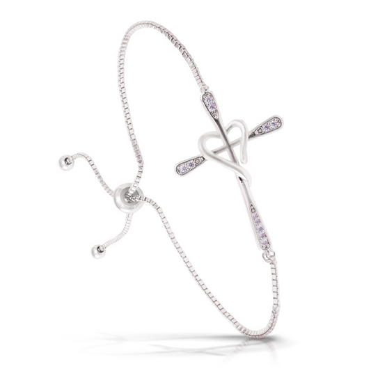Expertly crafted with silver material, our Cross Heart Bracelet features a unique adjustable pull chord design adorned with a beautiful cross heart pendant and sparkling rhinestone accents. The perfect accessory for adding a touch of faith and elegance to any outfit.