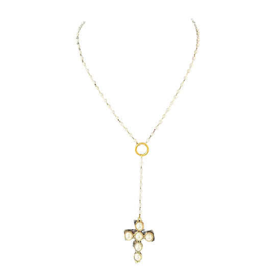 Elegant pearl cross necklace featuring lustrous pearl accents and a delicate gold-toned pendant. This short necklace offers a timeless, versatile look perfect for everyday wear or special occasions. The refined design combines classic symbolism with modern sophistication, making it an ideal accessory for layering or wearing solo.