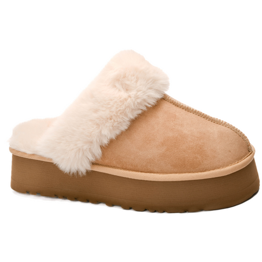 Experience ultimate comfort with Cuddle Up, the mule featuring a soft faux suede exterior in a stylish camel color. Designed by the trusted Corkys brand, these shoes also boast a fur-lined interior for added warmth. Treat your feet to luxury with Cuddle Up.