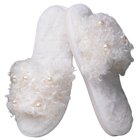 Step into luxurious comfort with our Curly Pearl Slippers. These slide-on slippers feature a beautiful white hue and chic pearl accent, combining style and comfort for your feet. Experience ultimate relaxation with these must-have slippers.