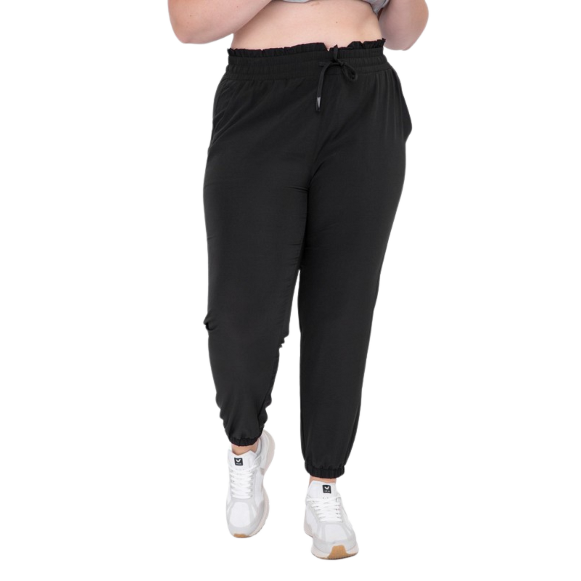 Be ready for your next adventure with these Curvy High Waisted Joggers. Crafted from premium fabric, they feature a high and elasticized waistband with drawstring closure, slanted pockets, and 7/8 length with cuffed ankles for a stylish look. Available in classic black color.