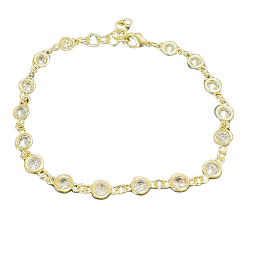 This Dainty Rhinestone Bracelet features a lightweight design and is crafted with a luxurious gold finish. The circle rhinestone detail adds a touch of elegance and sparkle to any outfit. Enhance your style with this beautiful and delicate bracelet.