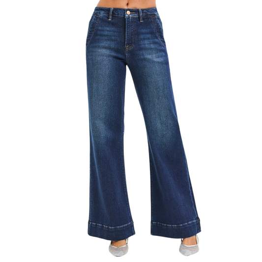 Elevate your denim game with these High Rise Flared Jeans from Risen. Crafted in a flattering dark wash, these wide-leg beauties feature built-in tummy control to smooth and shape your silhouette. The high-rise cut elongates your legs while the stretchy fabric moves with you all day. A timeless style that works for any occasion.