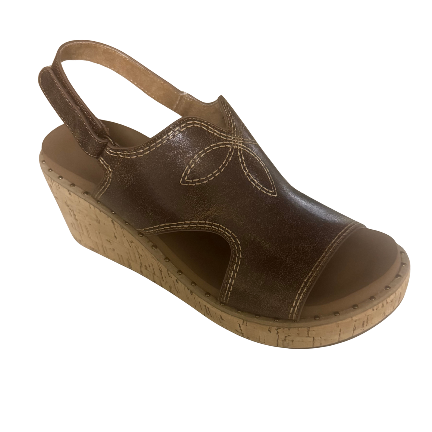 The Darlin brown wedge sandal from Corkys combines comfort with effortless style. Featuring a supportive wedge heel and quality construction, this versatile sandal transitions seamlessly from casual outings to weekend adventures. The rich brown tone pairs with any wardrobe, while the thoughtful design keeps your feet comfortable all day long. A timeless choice for those who value both function and fashion.