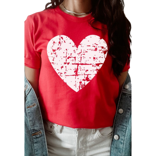 This Distressed Heart Graphic Tee is the perfect way to bring some color and style to your wardrobe. Its plus size offers comfortable and flattering fit for any body type and the nuanced red shade adds a subtle elegance. The heart graphic adds an extra touch of femininity to this fashionable tee.