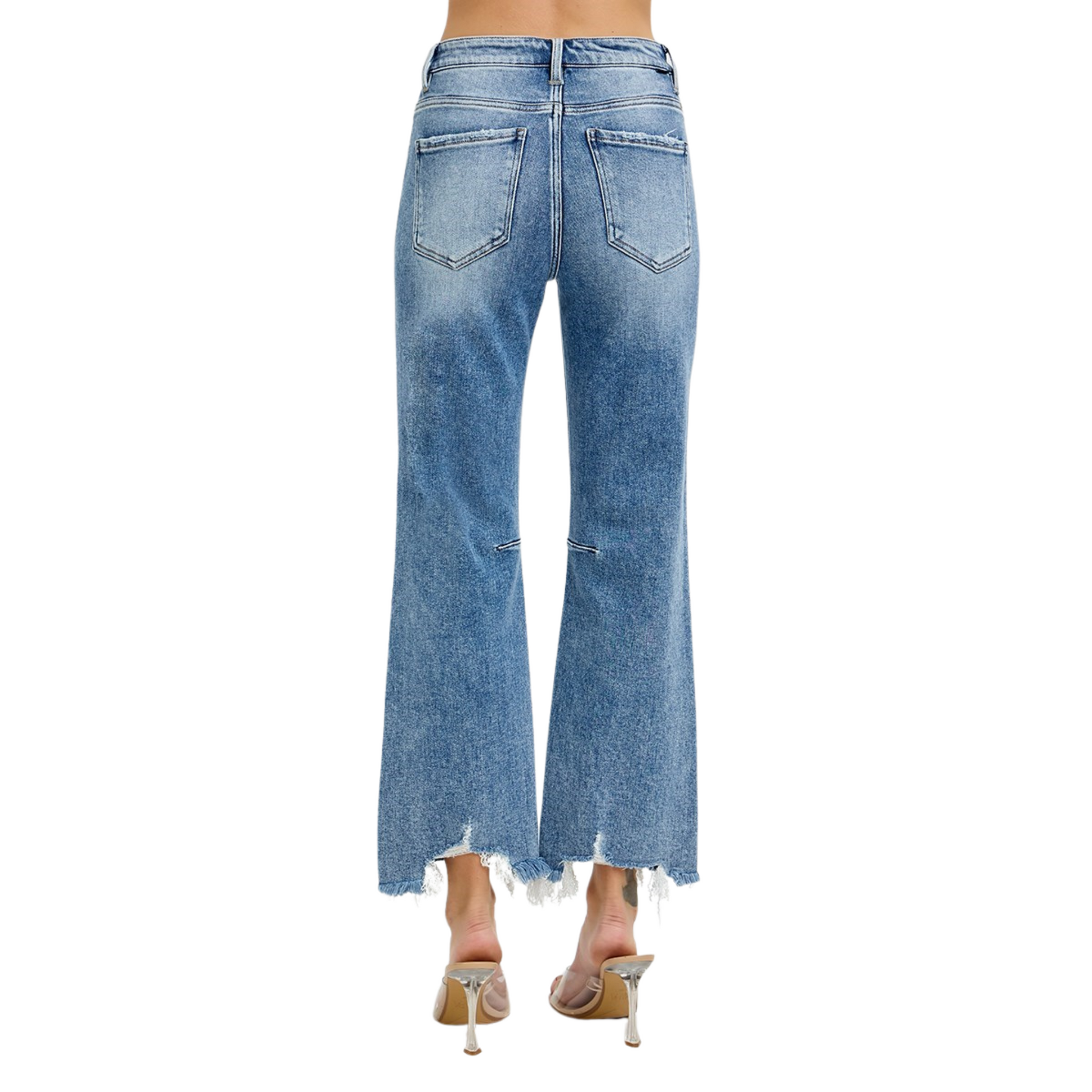 Expertly crafted by Risen, these High Rise Cropped Straight Jeans feature a medium wash for a classic look. The high rise waist provides a flattering fit, while the cropped length and distressed hem add a touch of trendiness. Elevate your denim game with these must-have jeans.