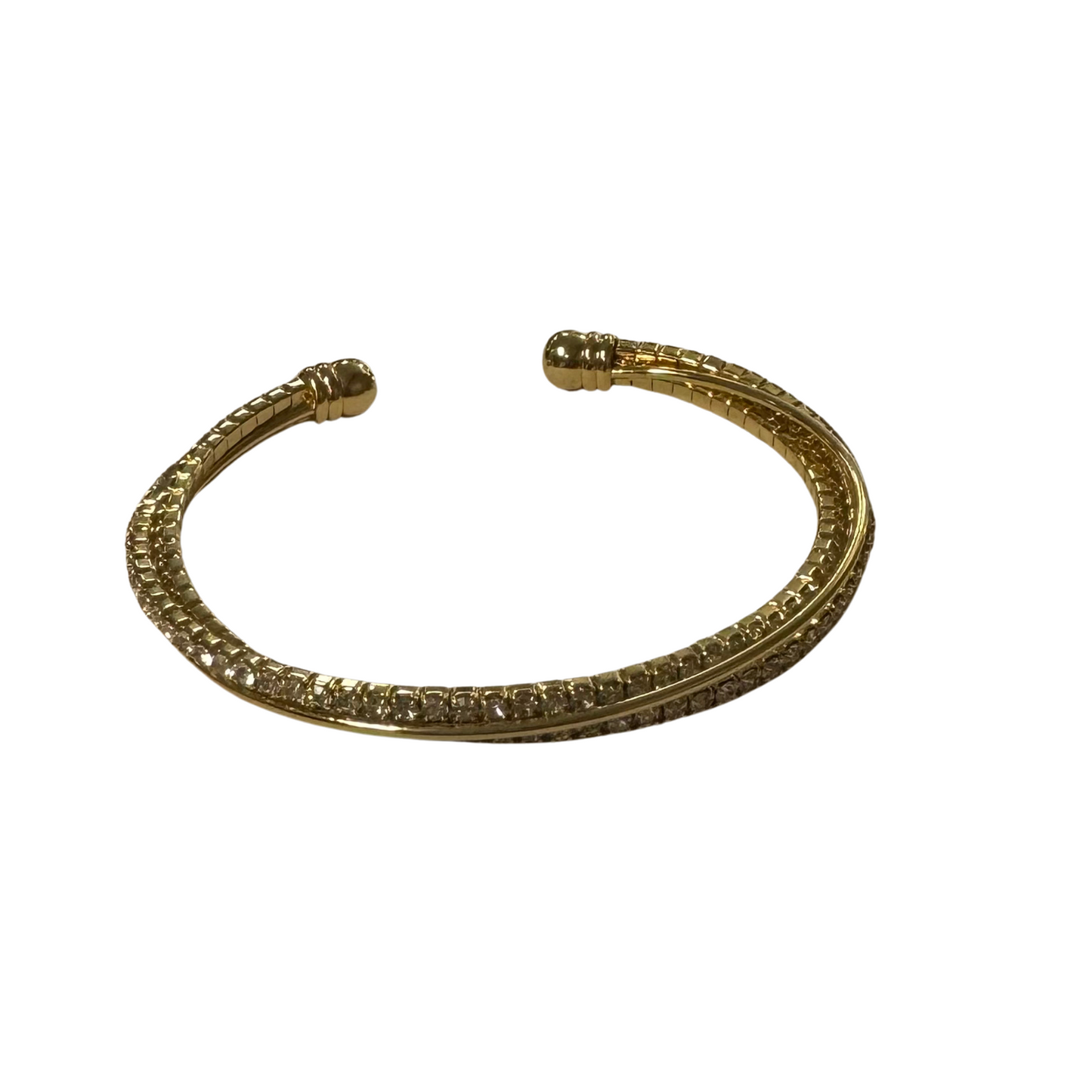 Crafted with luxurious gold and a sleek open bangle design, this Double Rhinestone Bangle adds a touch of glamour to any outfit. The double rhinestone design elevates the piece with a sparkling touch, making it a must-have for any fashion-forward individual. Perfect for special occasions or everyday wear.