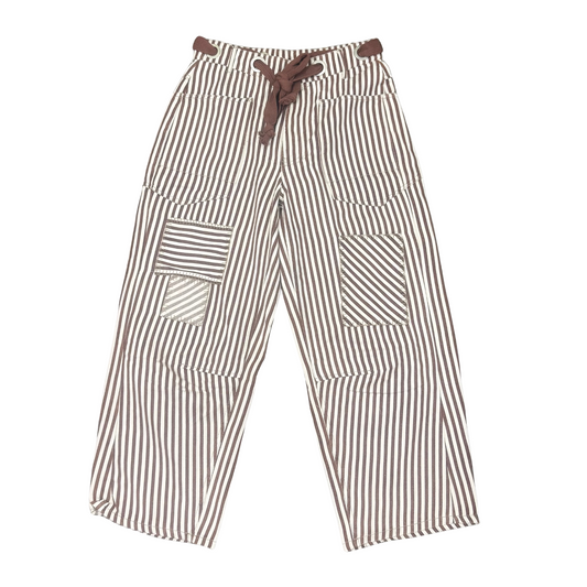 These Drawstring Barrel Pants feature a subtle striped pattern in a warm brownie cream color, combining style with comfort. Designed with a practical drawstring waist, they offer adjustable fit and ease of wear. Their relaxed barrel shape provides a modern silhouette suitable for casual or sophisticated looks. Ideal for those seeking versatile pants that blend understated design with functional details.