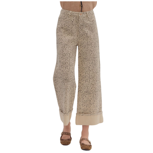 These High Waist Wide Leg Pants from Entro combine style and comfort with a trendy leopard print on a soft ecru background. Designed with a cropped length and a wide hem, they offer a flattering silhouette that balances fashion-forward aesthetics with relaxed wearability. Perfect for elevating your wardrobe with a bold yet sophisticated statement piece.