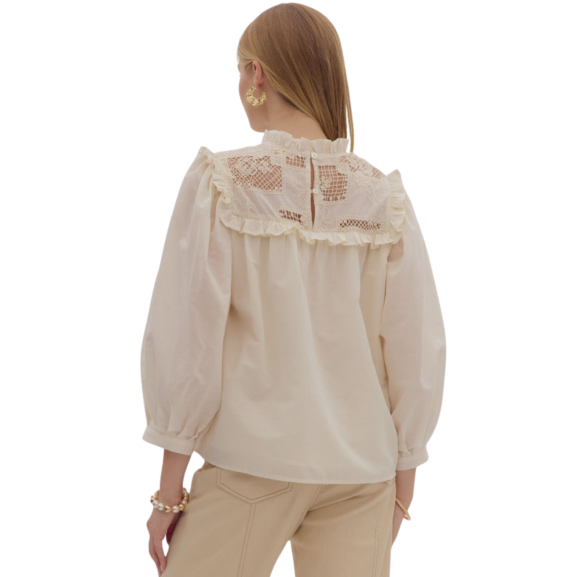 This ecru solid ruffle neck top adds a touch of elegance to your wardrobe. With ¾ puff sleeves and crochet lace detailing, you'll stand out in style. The lightweight, non-sheer fabric and button back closure make it both comfortable and practical. Perfect for any occasion.