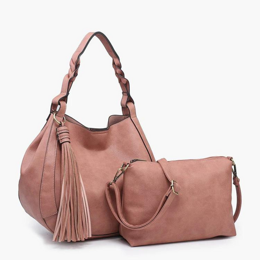 Meet Eloise, your perfect everyday hobo bag! Crafted from soft vegan leather and boasting a round shape, Eloise combines style and functionality seamlessly. Featuring a large side tassel, braided handle, and snap closure, it's designed with both fashion and practicality in mind. Additionally, an inner bag with slip and zip pockets is included, which can be used inside the main bag or carried separately with the adjustable crossbody strap.