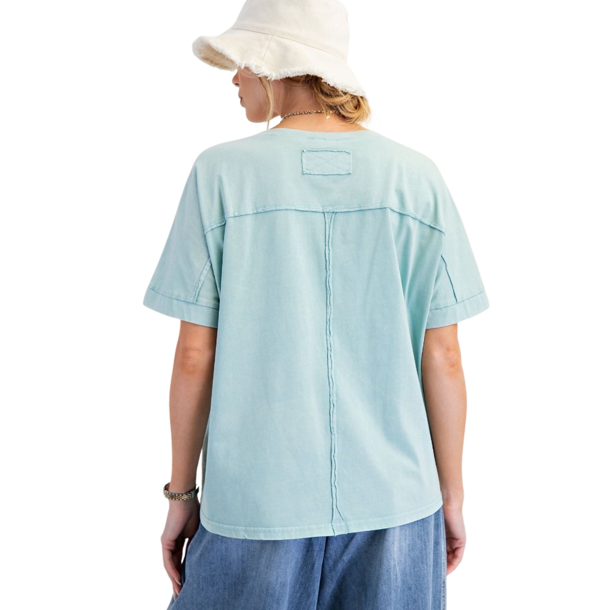 The Mineral Wash Boxy Top by Easel features delicate blue embroidered flowers that add subtle elegance to its laid-back design. Crafted for plus-size comfort, its short sleeves and relaxed boxy fit offer breathability and ease of movement. Ideal for warm days, this top combines soft mineral-washed fabric with expert tailoring to ensure a flattering, comfortable silhouette.