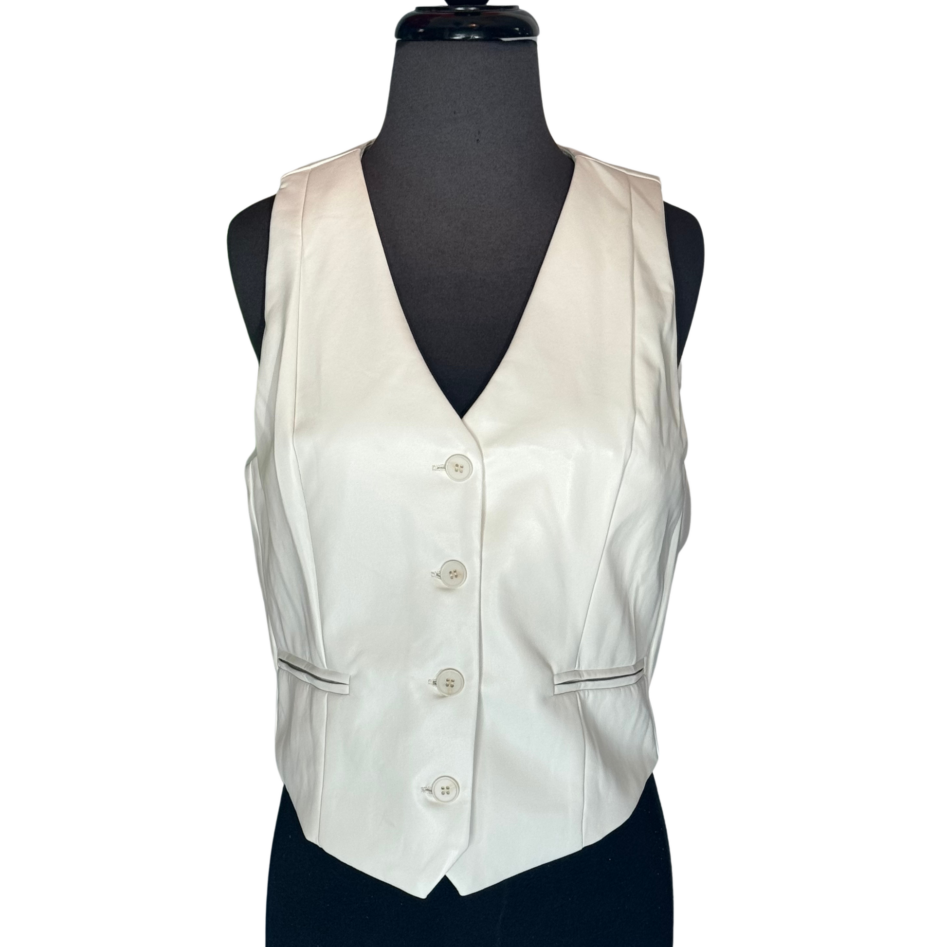 This stylish vest features a sleek faux leather material with a classic button front design. Perfect for adding a touch of edgy sophistication to any outfit, this vest is ideal for creating a modern look. The front button closure and simple silhouette make it a versatile addition to your wardrobe, suitable for both casual and dressy occasions.&nbsp;