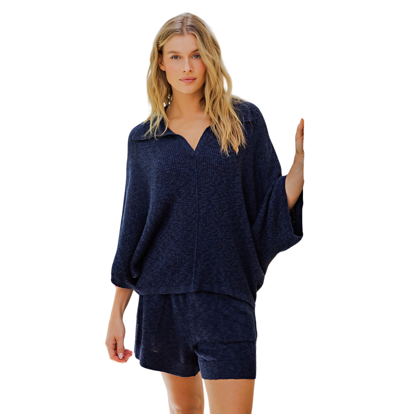 The Ferry Sweater from Cotierra combines timeless style with everyday comfort. This navy v-neck sweater features a classic collared design and three-quarter length sleeves, making it perfect for layering or wearing on its own. The refined silhouette works seamlessly with both casual and professional wardrobes, offering versatile styling options for any season.