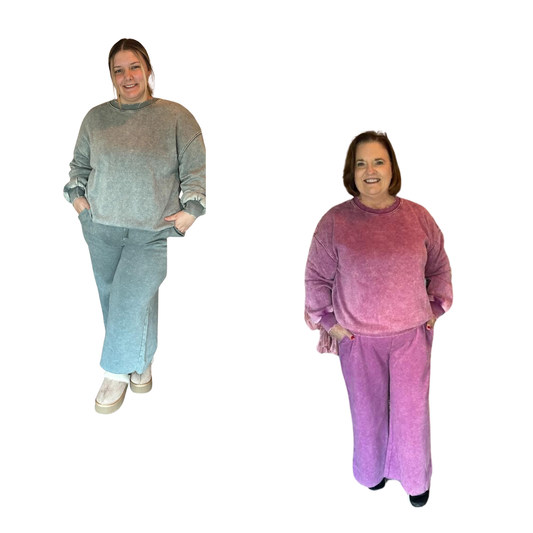 Elevate your casual wardrobe with this Zenana fleece set, featuring an acid-washed finish for distinctive style. The long-sleeve top pairs seamlessly with drawstring pants, delivering comfort and versatility for everyday wear. Available in sophisticated light plum or ash jade, this two-piece ensemble offers the perfect balance of relaxed fit and polished appeal. Ideal for layering or wearing solo, the premium fleece construction ensures lasting durability and warmth through any season.