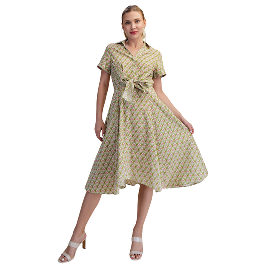 Elevate your everyday style with this charming Flower Print Shirt Dress from Glam. Featuring a vibrant floral print in rich green tones, this midi dress combines classic sophistication with modern flair. The collared neckline and short sleeves offer timeless appeal, while the front twist-tie detail adds a playful, flattering touch that cinches at the waist. Perfect for casual outings, brunch dates, or relaxed office settings, this versatile piece transitions seamlessly from day to night. The midi length pro