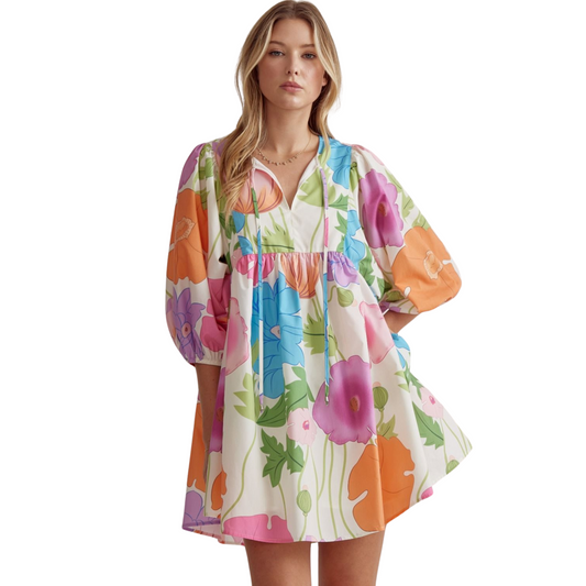 This floral mini dress is perfect for any occasion with its elegant half sleeve design and charming self-tie detail at the neckline. Its elasticized cuffs and side pocket provide both comfort and practicality. Made with woven material, this dress is lined and lightweight, making it non-sheer. Look stunning and feel confident in this must-have piece.