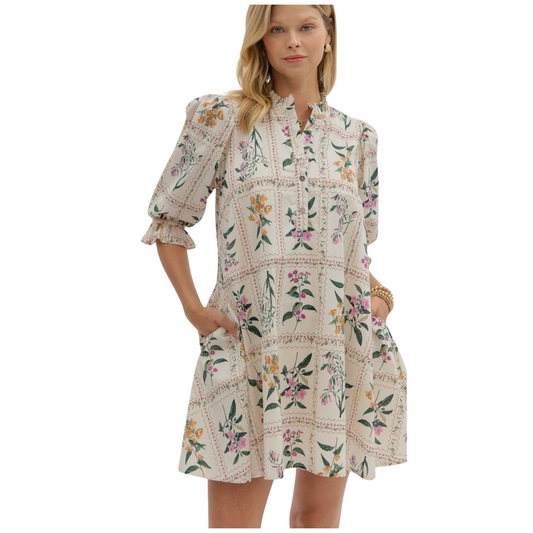 Floral panel ¾ ruffle finish puff sleeve pleated round neck button closure at front mini dress featuring adjustable back waist. Side pockets. Lined. Woven. Non-sheer. Lightweight.