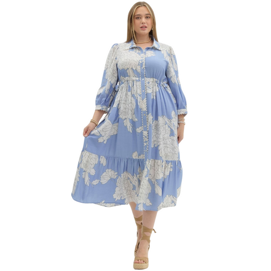 This floral print dress from Entro is perfect for plus size women looking for a stylish and comfortable midi dress. The tiered design adds a touch of elegance, while the button up closure and collared neckline provide a polished look. Upgrade your wardrobe with this must-have piece from a trusted brand.