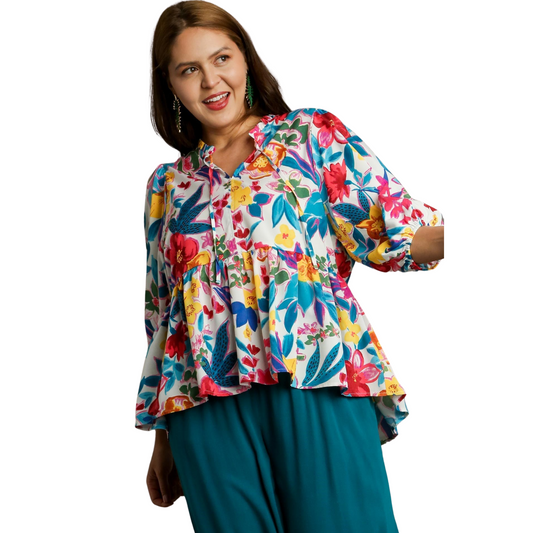 This plus size babydoll top features a beautiful floral print that adds a touch of femininity to any outfit. The balloon sleeves and v-neckline provide a flattering and comfortable fit, making it a versatile and stylish addition to your wardrobe.