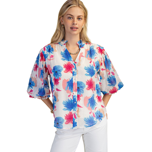 Elevate your casual wardrobe with this charming floral button down top from GiGio. Featuring a vibrant blue mix floral print, this short sleeve style offers effortless everyday elegance. The classic button-down design makes it versatile enough to dress up or down, perfect for pairing with jeans, skirts, or tailored pants. Soft, breathable fabric keeps you comfortable throughout the day while the timeless floral pattern adds a fresh, feminine touch to any outfit.