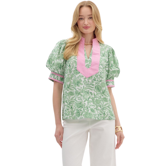 Expertly designed with a vibrant floral print, this pullover top boasts voluminous puff sleeves and a caftan-inspired high neck band for a unique and stylish look. The split V-neck and cuff finish add a touch of contrast to this lightweight and non-sheer woven top. Perfect for adding a pop of color to any outfit.
