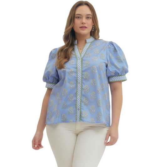 Effortless elegance meets comfort in this stunning Entro floral puff sleeve top. The vibrant blue floral print brings a fresh, feminine touch to your wardrobe, while the flattering V-neckline creates a graceful silhouette. Designed for the modern plus-size woman, the relaxed puff sleeves add movement and style without compromising on wearability. Perfect for casual outings, weekend brunches, or layering with your favorite pieces.