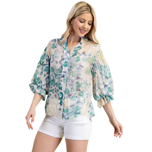 Elevate your wardrobe with this charming GiGio floral button down top. Featuring a vibrant half-sleeve design and delicate floral print, this piece effortlessly transitions from casual days to weekend outings. The classic button-down silhouette offers timeless style with a modern botanical twist. Perfect for layering or wearing solo, this versatile top pairs beautifully with jeans, skirts, or trousers for endless styling possibilities.